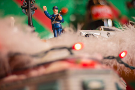 Police officer holiday figurine waving and toy police carのeditorial素材