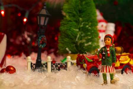 Augusta, Ga USA - 12 05 20: Coca Cola Holiday Vintage Village collectiolittle girl looking up fire truck left spaceのeditorial素材