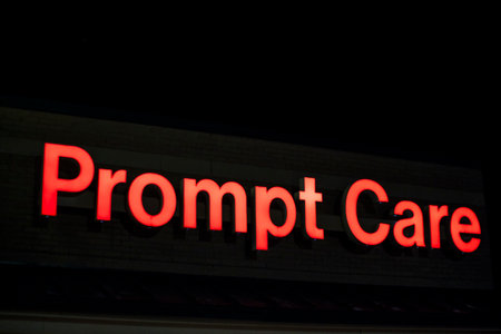 Augusta, Ga USA - 11 04 20: Prompt Care red building sign only medical facility at nightのeditorial素材