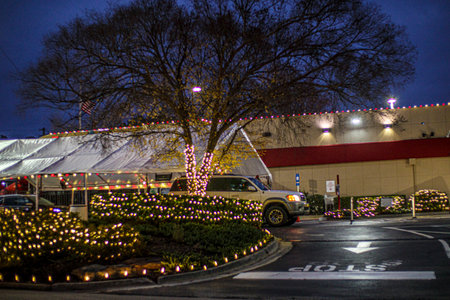 Augusta, Ga USA - 12 17 20: Holiday decorations at Chick Fil A at night on Washington Road drive thru tentのeditorial素材