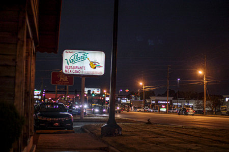 Augusta, Ga USA - 12 17 20: Vallanta mexican restaurant street sign and trafficのeditorial素材