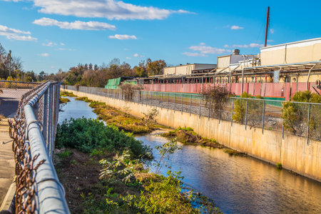 Augusta, Ga USA - 12 03 20: A canal in an industrial area overgrownのeditorial素材
