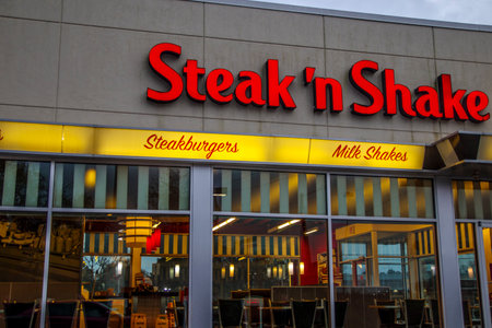 Augusta, Ga USA - 01 01 21: Steak n Shake building sign and interior through windowsのeditorial素材