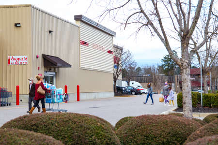 Augusta, Ga USA 01 07 21: Lady without a face mask and people wearing face masks