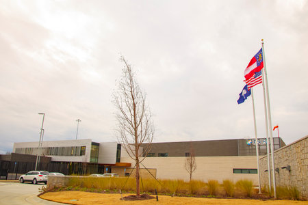 Augusta, Ga USA - 01 20 21: News channel 12 building and American Flag with parked carsのeditorial素材