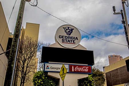 Atlanta, Ga USA - 03 20 20: Georgia State digital street sign and clouds downtown Atlanta Georgia