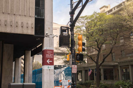 Atlanta, Ga USA - 03 20 20: Downtown Atlanta Valet parking sign traffic signal and buildingsのeditorial素材