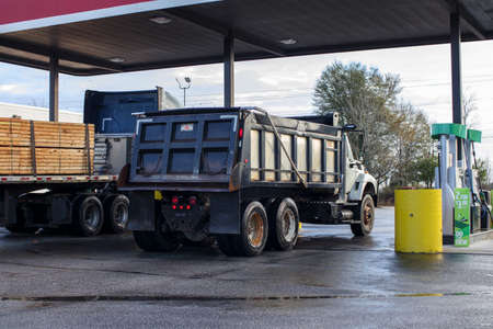 Richmond County, Ga USA - 03 03 21: A dump truck at a diesel pump back cornerのeditorial素材