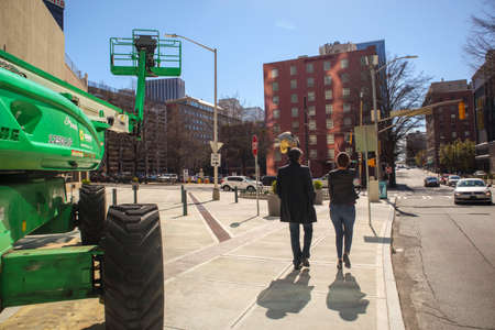 Atlanta, Ga USA - 03 07 20: Downtown Atlanta Georgia people walking and traffic with construction equipmentのeditorial素材