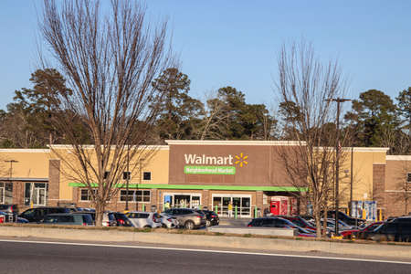 Columbia County, Ga USA - 01 30 21: t Walmart Neighborhood market through trees street view