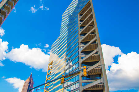 Atlanta, Ga / USA - 05 30 20: A skyscraper reflects the blue sky and clouds