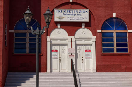 Covid-19 warning signs on a Church entrance - Trumpet Zion Fellowship downtown Augusta Georgia