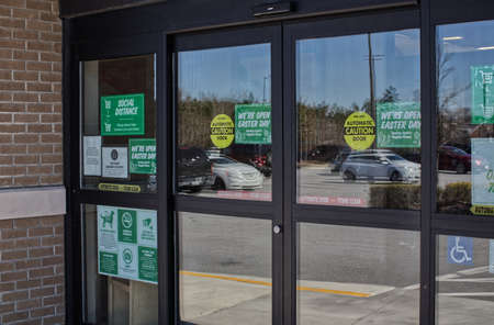 Augusta, Ga USA - 03 04 21: Sprouts grocery retail store entrances signs on doors
