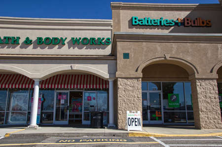 Augusta, Ga USA - 03 04 21: Batteries Plus OPEN sign Strip mall - Robert C Daniel Parkwayのeditorial素材