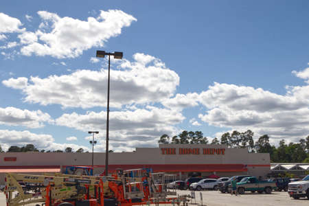 Columbia County, Ga USA - 04 25 21:  Home Depot retail store building sign and parking lot with people - Bobby Jones Expressway