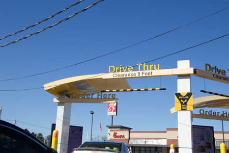 Columbia County, Ga USA - 03 04 21:  Drive thru clearance sign McDonalds with cars