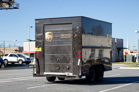 Augusta Ga USA - 03 04 21:  A brown and gold UPS trailer parked in a parking lot