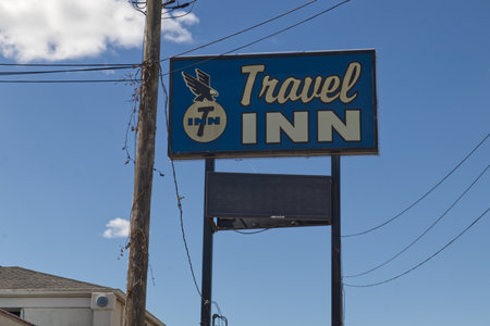 Augusta, Ga USA - 04 25 21: Travel Inn vintage motel street sign on Washington Roadのeditorial素材