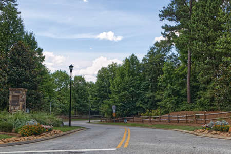 Augusta, Ga  USA - 06 26 21: Entrance to a luxury neighborhood stone sign column roadwayのeditorial素材