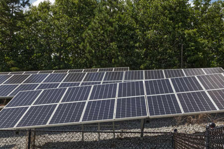 Close up Rows of Solar panels behind a fence in Georgia