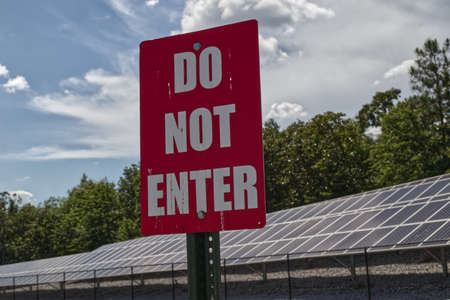 Do Not Enter sign and Rows of Solar panels behind a fence and in Georgiaの写真素材