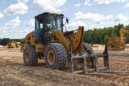Augusta, Ga USA - 09 10 21: Construction site Front loader and heavy industrial machinery