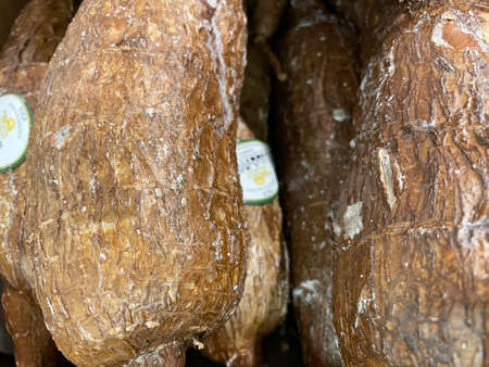 Brown tropical Yuka root on display in a retail store in Georgiaの写真素材