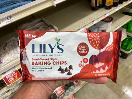 Augusta, Ga USA - 04 15 22: Hand holding Lilys baking chips semi sweet styleのeditorial素材
