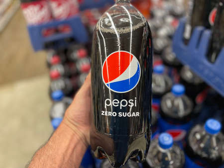 Grovetown, Ga USA - 05 01 22: Retail store Hand holding a Pepsi 2 liter