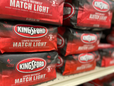 Grovetown, Ga USA - 05 01 22: Retail store BBQ charcoal bags Match light