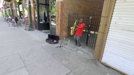 Augusta, Ga USA - 07 10 20: Man plays saxophone downtown Augusta for moneyのeditorial素材