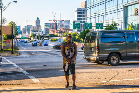 Atlanta, Ga USA - 05 30 20: Police barricade breaks up as man looks the other wayのeditorial素材