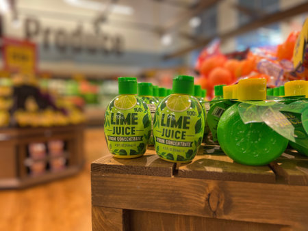 Grovetown, Ga USA - 06 21 22: Retail store Small bottles of lime juice in a produce departmentのeditorial素材