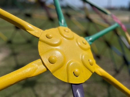 Kiddie park yellow plate and green bars Monkey bars background texture