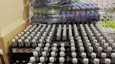 Grovetown, Ga USA - 02 01 22: Grocery store Coke tops and wrapped pepsi palletのeditorial素材