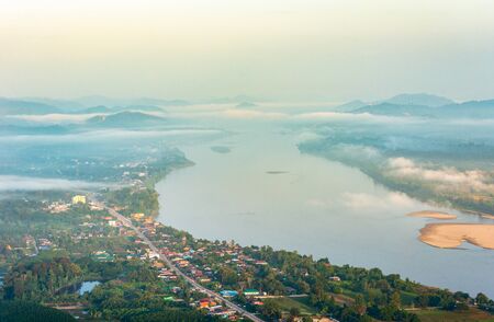 Pha Tak Sue temple Viewpoint, overlooking the Mekong River and the fog in the morning lightの写真素材