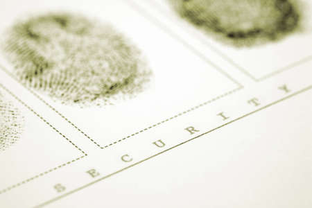 A fingerprint on a white sheet of paperの写真素材