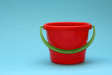 Red bucket and a blue backgroundの写真素材