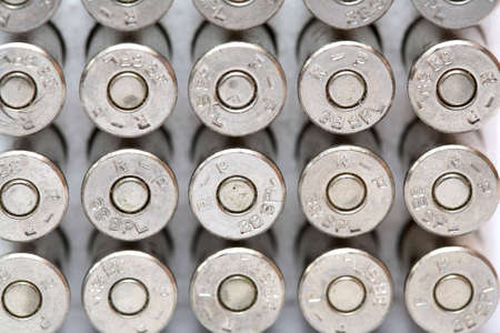 Cartridge for a handgun and a white backgroundの写真素材