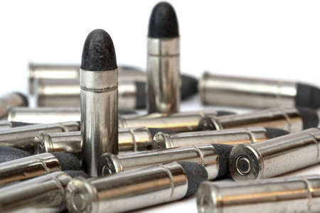 Cartridge for a handgun and a white background