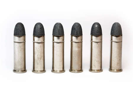 Cartridge for a handgun and a white backgroundの写真素材