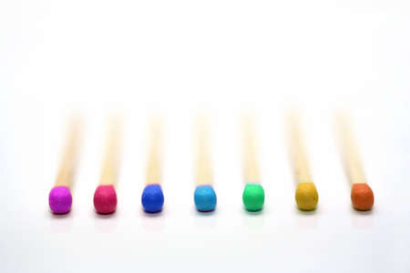 Some colorful matches and a white backgroundの写真素材