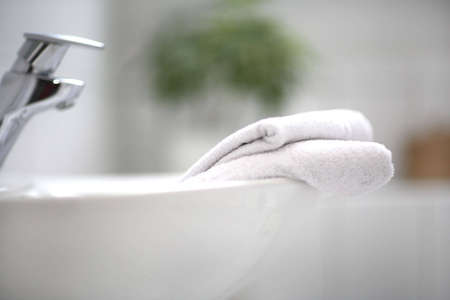 A washbowl and two towelsの写真素材