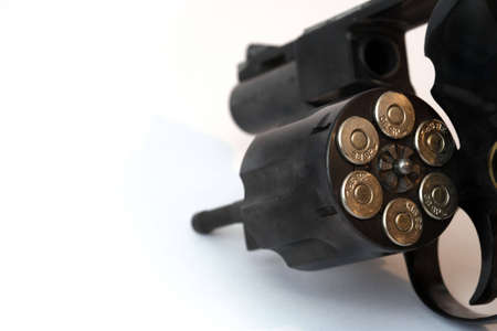Cartridges for a handgun and a white backgroundの写真素材