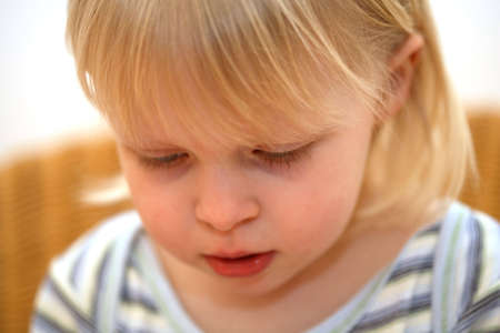 face of a little girl and a white background