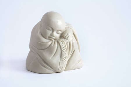 a sleeping buddha and a white backgroundの写真素材