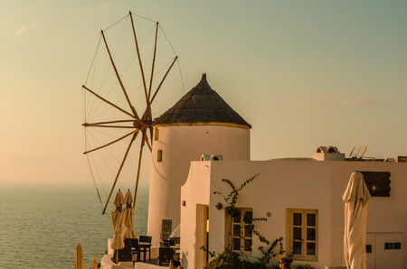 SUNSET OVER THE MILL OF THE GREEK ISLAND - OIA - SANTORINIのeditorial素材