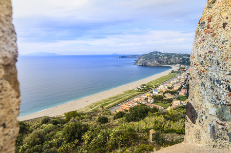Defenses of the Norman castle of milazzo coastline with beaches of the Tyrrhenian Sea and on the horizon you can get to see the outline of the Aeolian Islandsのeditorial素材