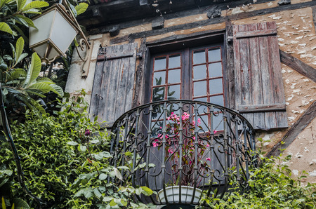 Typical and flowery medieval balcony of the French Southの写真素材