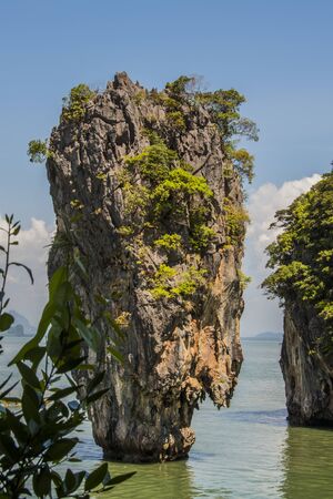 Close-up of karst limestone tower emerging from the Andaman Sea in the vicinity of Phuket. thailand asiaの写真素材